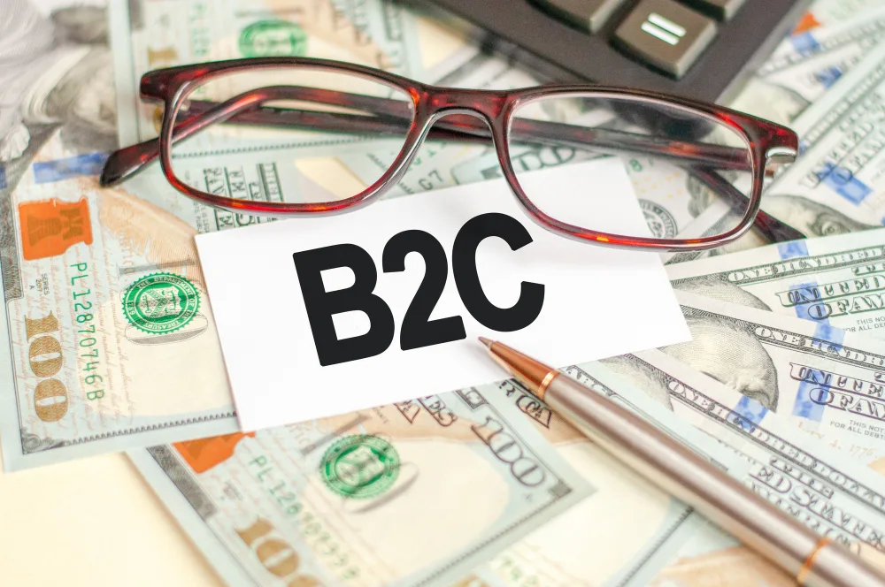 finance-business-concept-table-are-bills-glasses-pen-sign-which-it-is-written-b2c-b2c-business-consumer-1